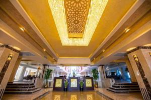 a large lobby with a large chandelier hanging from the ceiling at Casablanca Beach for families only in Hurghada +43 photos