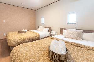 Postel nebo postele na pokoji v ubytování グランディオーソ沖縄プールヴィラ恩納8 + 130 fotografií