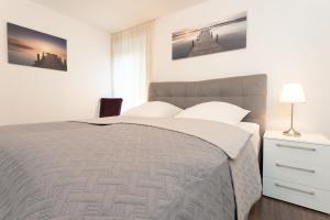 Ένα ή περισσότερα κρεβάτια σε δωμάτιο στο Strandidyll 3