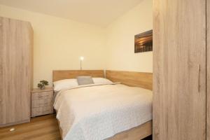 Postel nebo postele na pokoji v ubytování Lindenbuschen 2 Wohnung 3