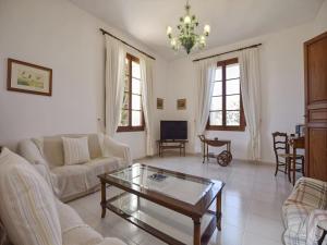 a living room with a couch and a coffee table at Holiday Home in Migjorn with Private Pool in Llucmajor