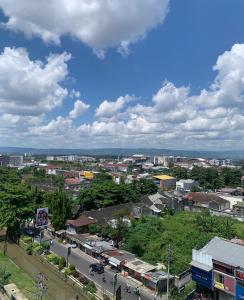 a view of a city with traffic on a street at Student park Apartment by ATA in Seturan
