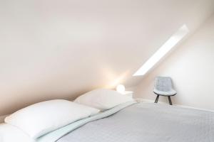 Postel nebo postele na pokoji v ubytování Kammerweg 89 Düne 28