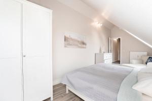 Postel nebo postele na pokoji v ubytování Kammerweg 89 Düne 28