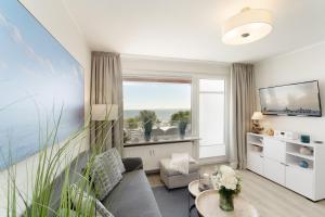 TV a/nebo společenská místnost v ubytování Strandschloss Horizont