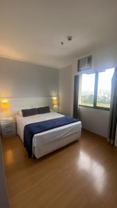 Postel nebo postele na pokoji v ubytování Flat hotel aeroporto de congonhas 4 hospedes