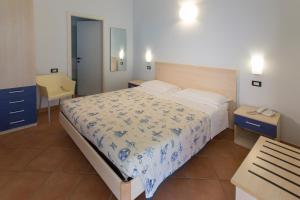 Postel nebo postele na pokoji v ubytování Hotel Vila Bahia