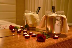 a bunch of candles on a table with a blender at AmbientHotels Panoramic in Rimini