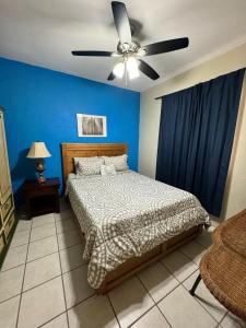 a bedroom with a bed and a ceiling fan at Palacio Del Mar - Oceanfront in Puerto Peñasco +286 photos