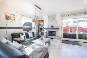 a living room with a couch and a fireplace at Ostseestern in Grömitz