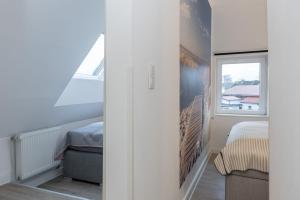 Postel nebo postele na pokoji v ubytování Haus MeerReet ReetGlück