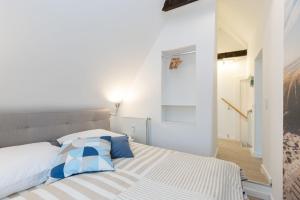Postel nebo postele na pokoji v ubytování Haus MeerReet ReetGlück