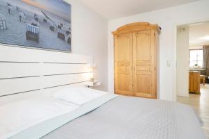Ein Bett oder Betten in einem Zimmer der Unterkunft Ostseegarten Goldulme