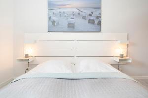 Ein Bett oder Betten in einem Zimmer der Unterkunft Ostseegarten Goldulme