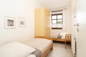 Ein Bett oder Betten in einem Zimmer der Unterkunft Ostseegarten Goldulme