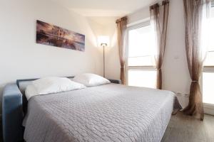 Ένα ή περισσότερα κρεβάτια σε δωμάτιο στο Ostseebrise +15 φωτογραφίες