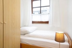 Postel nebo postele na pokoji v ubytování Ostseegarten Lorbeer