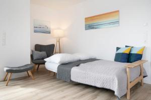 Postel nebo postele na pokoji v ubytování Brenkenhagener Weg 4 Strandläufer