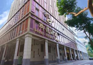 a building with a sign on the side of it at Royal Dragon Hotel in Macau