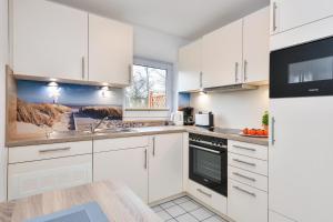 Kuchyň nebo kuchyňský kout v ubytování Lindenbuschen 2 Wohnung 2