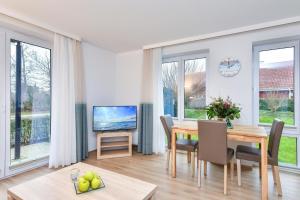 TV a/nebo společenská místnost v ubytování Lindenbuschen 2 Wohnung 2