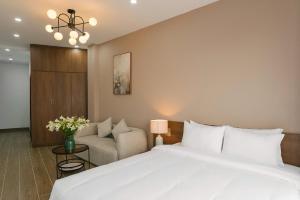 An Nguyen Lakeside Residence客房内的一张或多张床位