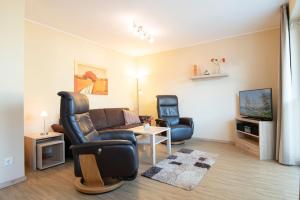 TV a/nebo společenská místnost v ubytování Waldstraße 16 Wohnung Eckhoff