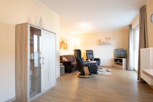 TV a/nebo společenská místnost v ubytování Waldstraße 16 Wohnung Eckhoff