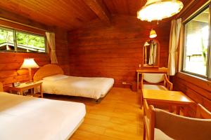 Postel nebo postele na pokoji v ubytování Karuizawa Prince Hotel West