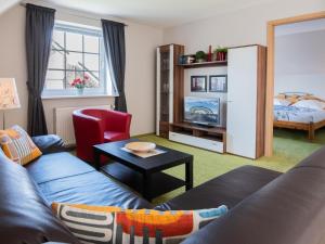 TV a/nebo společenská místnost v ubytování Haus Behrens Wohnung 1