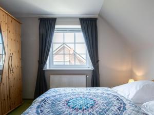 Postel nebo postele na pokoji v ubytování Haus Behrens Wohnung 1