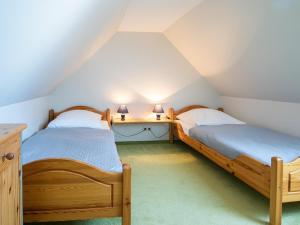 Postel nebo postele na pokoji v ubytování Haus Behrens Wohnung 1