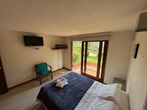 Postel nebo postele na pokoji v ubytování Apartasuites Las Marías