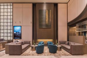 Posezení v ubytování Guangzhou Olympic Sports Centre Financial City Crystal Orange Hotel