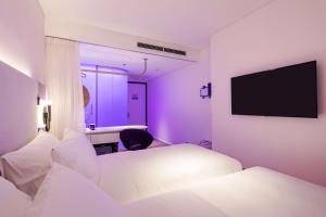 Voodi või voodid majutusasutuse Tru by Hilton Hanoi Station toas