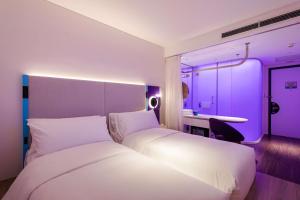 Voodi või voodid majutusasutuse Tru by Hilton Hanoi Station toas