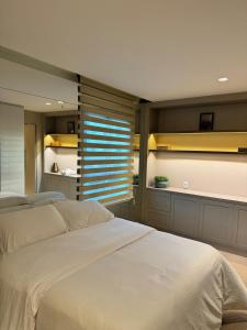 En eller flere senge i et værelse på Espetacular - Flat no Jade Hotel Brasília