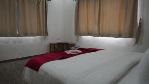 Postel nebo postele na pokoji v ubytování Diyar Villas Puncak H1/6