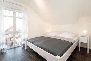 Ένα ή περισσότερα κρεβάτια σε δωμάτιο στο Bürgermeister-Fox 42 Traumhaftes-Fehmarn