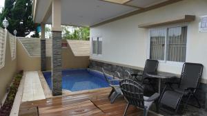 Bazén v ubytování Diyar Villas Puncak H8/7 nebo v jeho okolí