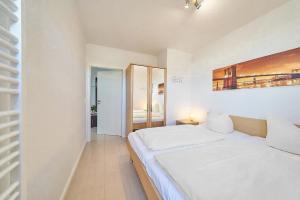 Postel nebo postele na pokoji v ubytování Grömitz Center Seebrückenblick Grömitz + 10 fotografií