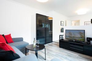 TV a/nebo společenská místnost v ubytování Rosenstraße 1a Bootshaus + 28 fotografií