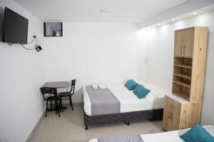 TV a/nebo společenská místnost v ubytování Hotel Laureles Aburrá