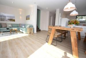 a living room with a table and a couch at Heimathafen Dahme in Dahme