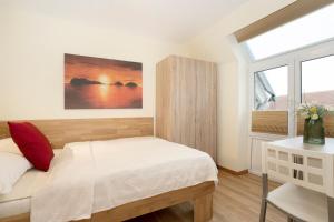Postel nebo postele na pokoji v ubytování Lindenbuschen 2 Wohnung 6