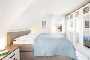 Postel nebo postele na pokoji v ubytování Strandresidenz Wohnung 7
