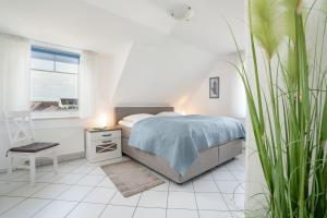 Postel nebo postele na pokoji v ubytování Strandresidenz Wohnung 7