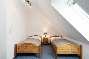 Postel nebo postele na pokoji v ubytování Strandresidenz Wohnung 7
