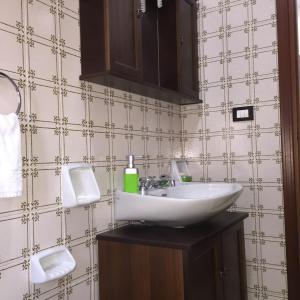 a bathroom with a white sink and a mirror at Casa Terme in Sciacca +55 photos