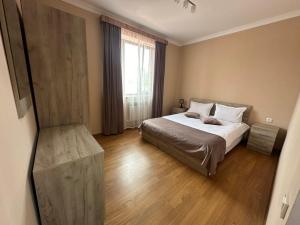 Ein Bett oder Betten in einem Zimmer der Unterkunft Zartonq